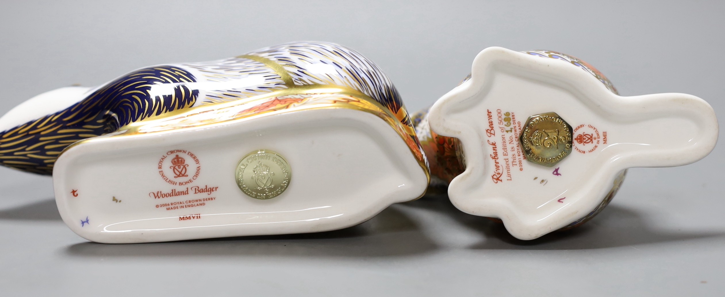 Two Royal Crown Derby paperweights - Riverbank Beaver, limited edition, 1686/5000, gold stopper, boxed with certificate and Woodland Badger, gold stopper, boxed, no certificate.